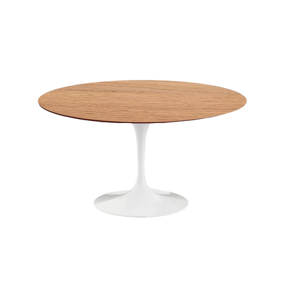 Round wooden tulip table with white pedestal base on a white background