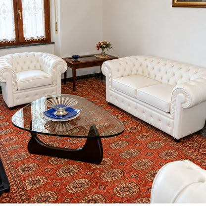 White Chesterfield 2-seater leather sofa with deep diamond button tufting, rolled scroll arms, plush seat cushions and classic British-inspired design, ideal for luxury living rooms, boutique hotels, executive offices and elegant contemporary interiors.