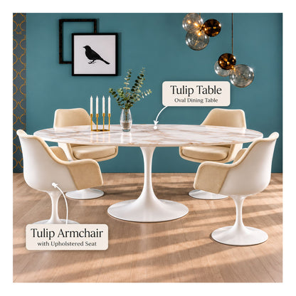 White oval Tulip dining table with four upholstered Tulip armchairs in a modern dining room featuring a marble-effect tabletop, white pedestal base and cream fabric seats.