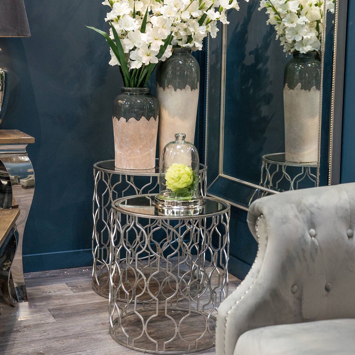Set of two arabesque silver foil mirrored side tables