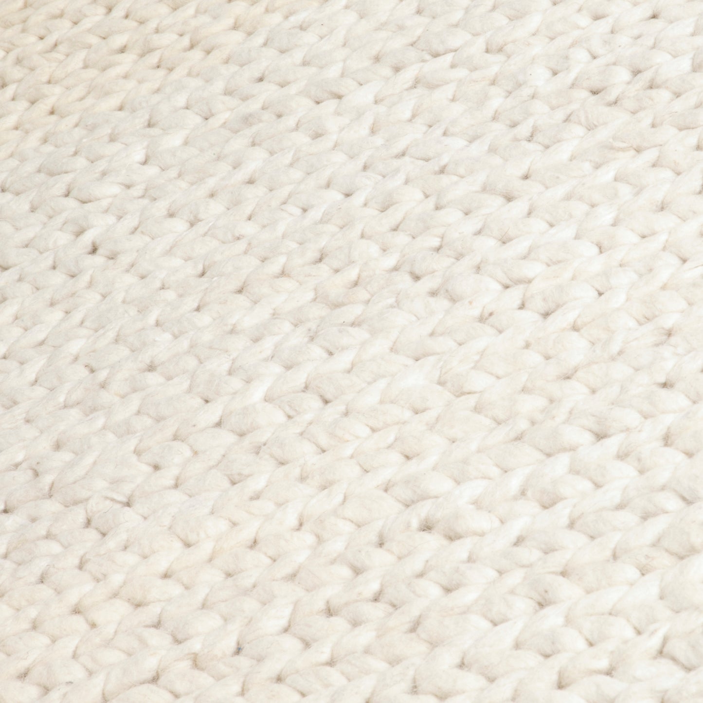 Cream knitted wool rug by Native