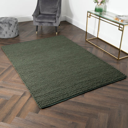 Green knitted wool rug by Native