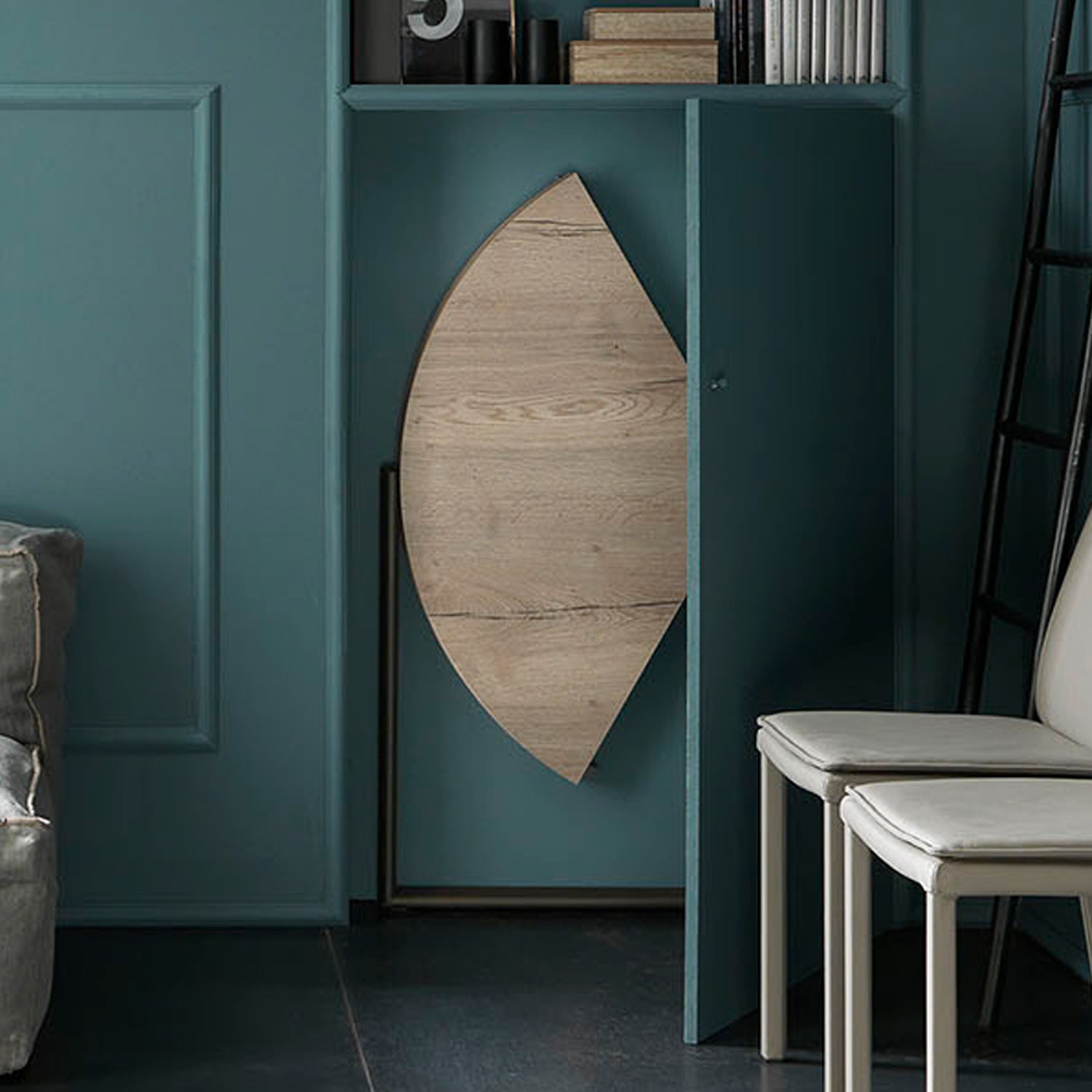Altacom Icaro folding dining table stored vertically in compact space showing ultra slim design