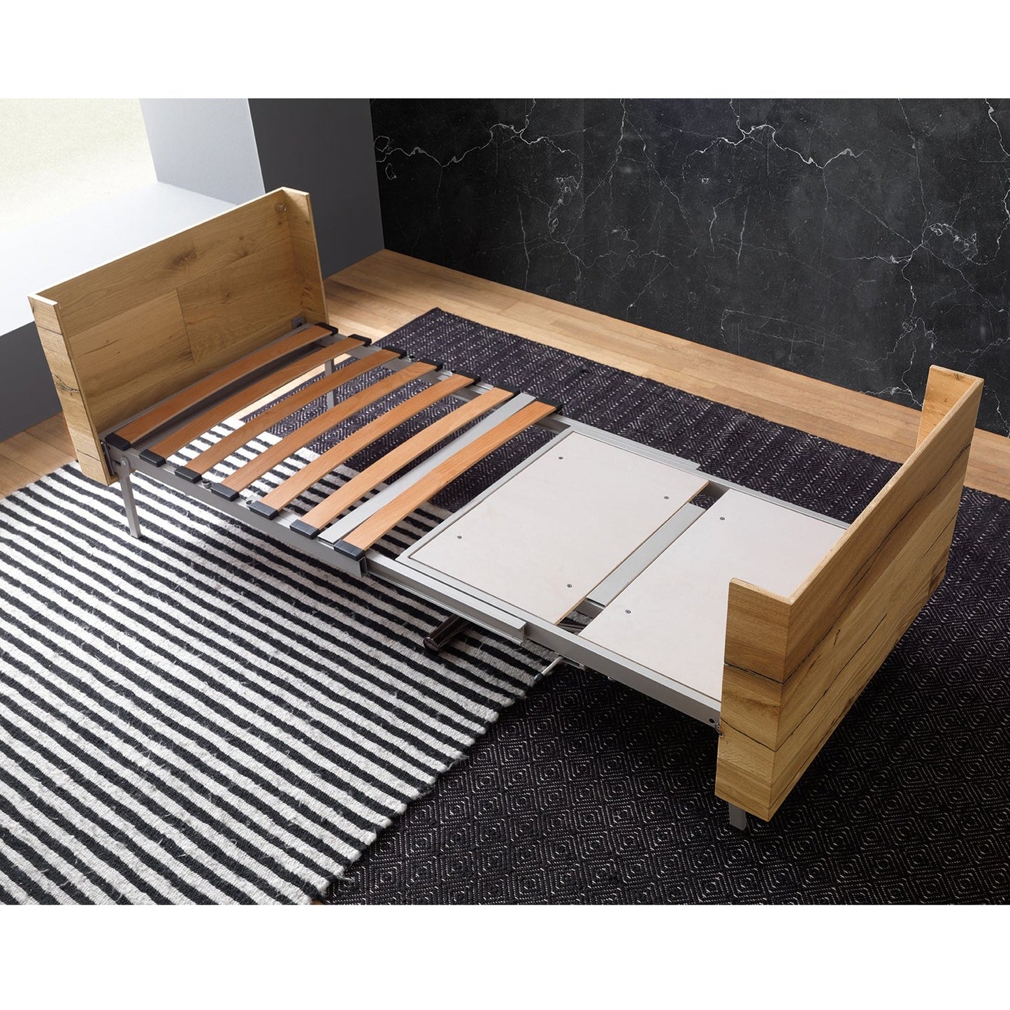Altacom Tavoletto convertible table showing bed frame with slats fully extended during transformation