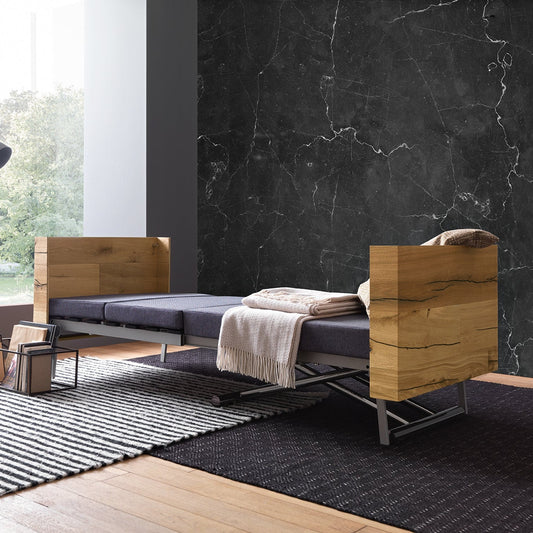 Altacom Tavoletto convertible table fully opened as single bed with mattress in modern living space