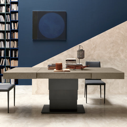 Ares Fold extendable dining table by Altacom with ceramic top and central pedestal base in modern interior setting