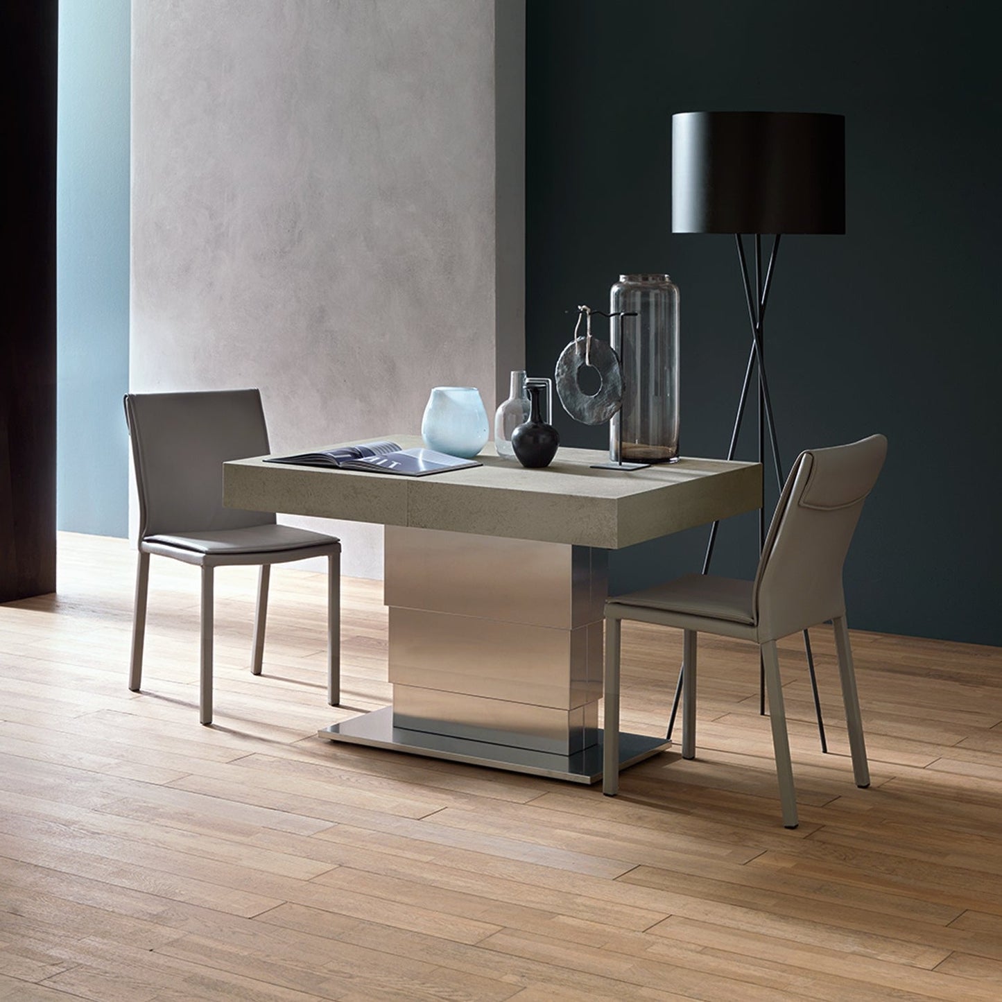 Ares Mega convertible table raised to dining height with chairs in compact configuration by Altacom