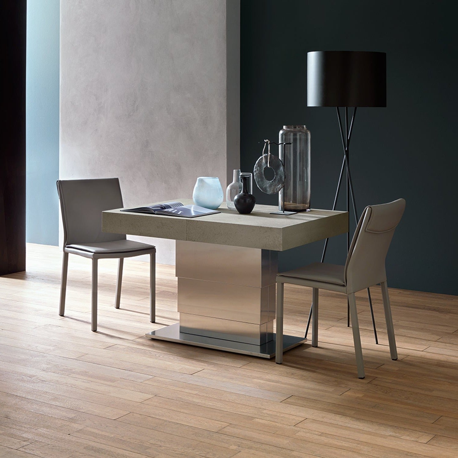 Ares Mega convertible table raised to dining height with chairs in compact configuration by Altacom