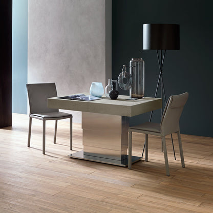 Ares Mega convertible table raised to dining height with chairs in compact configuration by Altacom