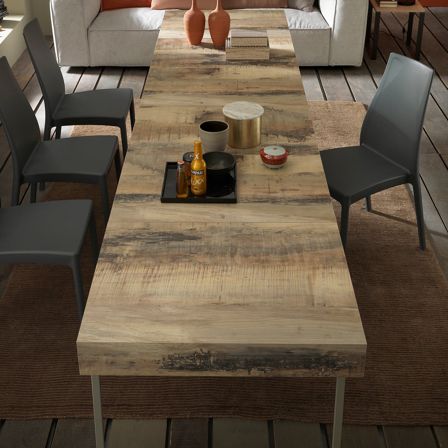 Assist convertible table by Altacom extended to large dining table shown from top view with chairs demonstrating seating capacity