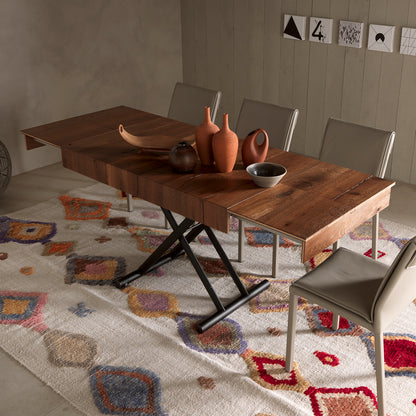 Double convertible table by Altacom extended as dining table with multiple chairs showing hosting setup and X base design