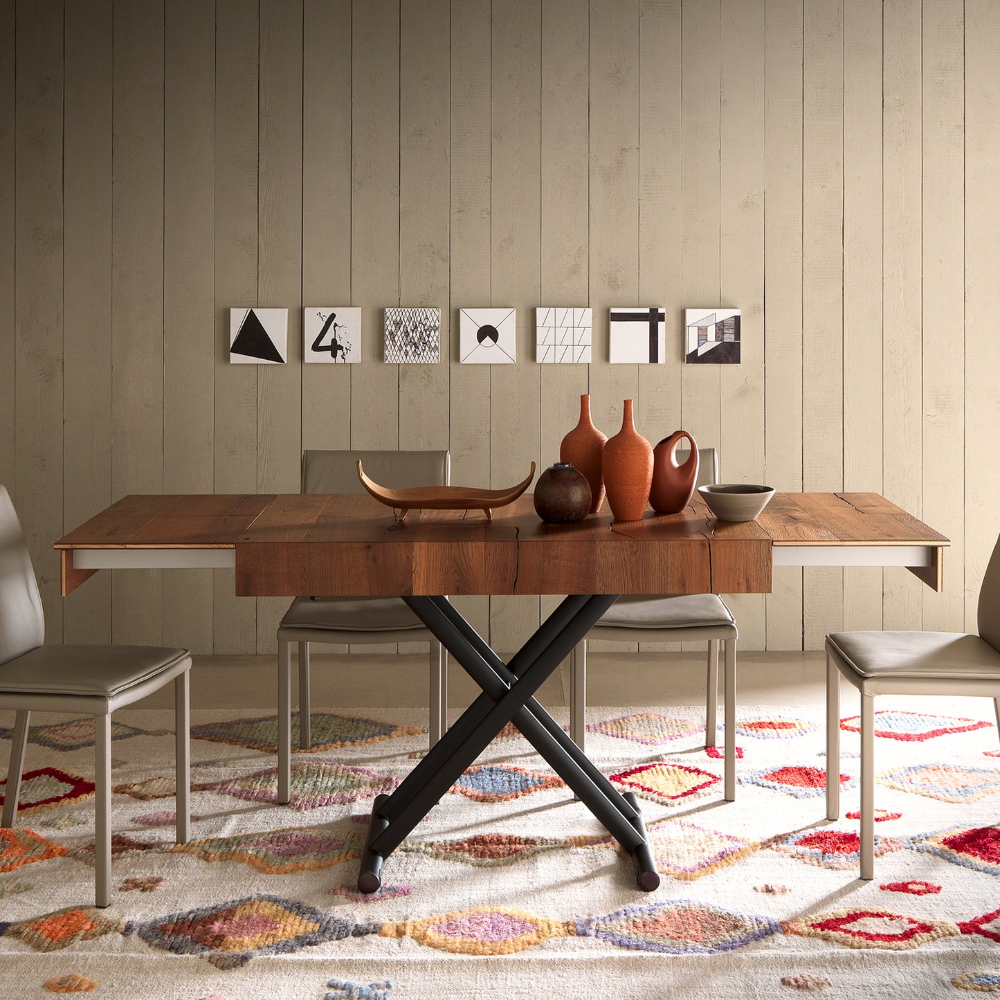 Double convertible table by Altacom fully extended as dining table with chairs and X base structure