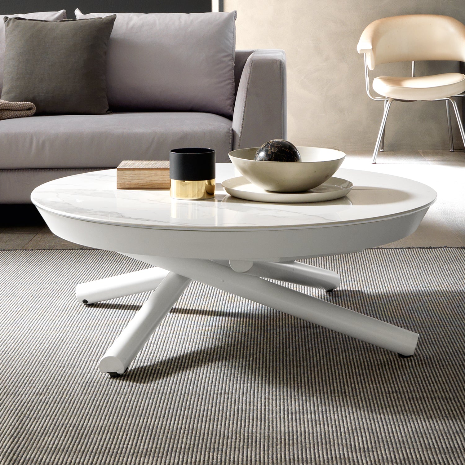 White Helios transforming coffee table by Altacom with marble-effect ceramic top and crossed metal base