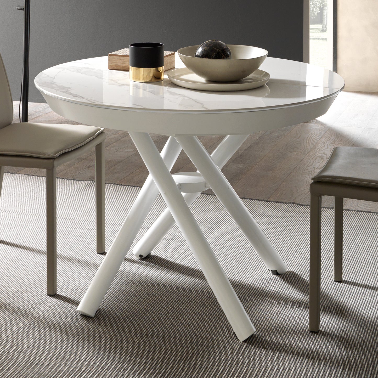 White Helios transforming dining table by Altacom with marble-effect ceramic top and crossed white metal base