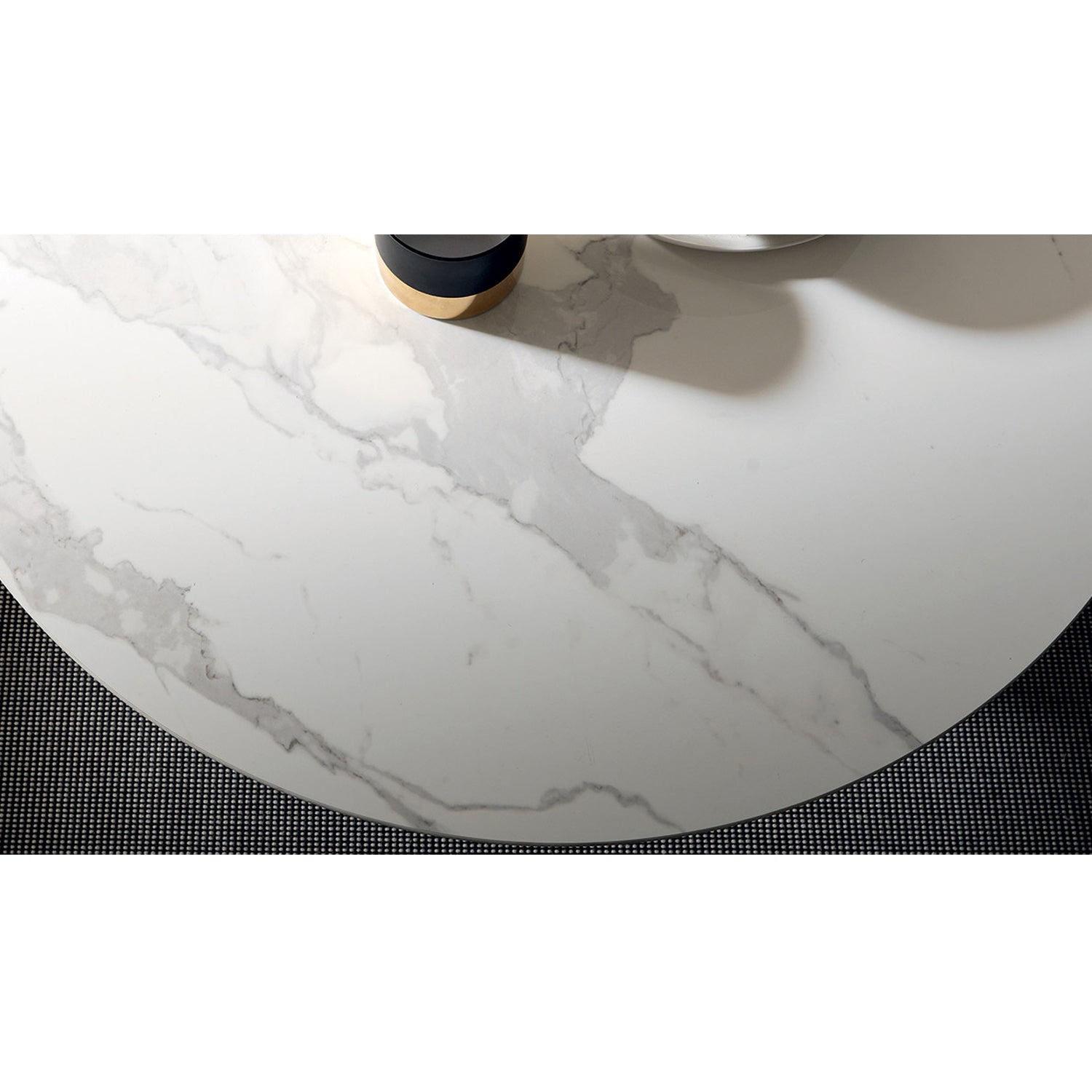Close-up of Helios transforming table by Altacom with white marble-effect ceramic top and rounded edge