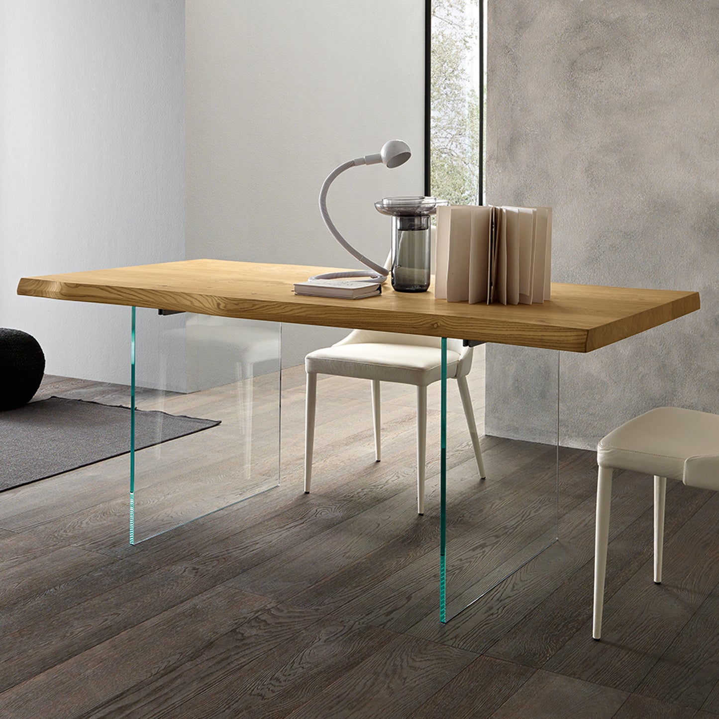 Meridiano extendable dining table by Altacom with transparent glass legs and wood top creating floating design effect