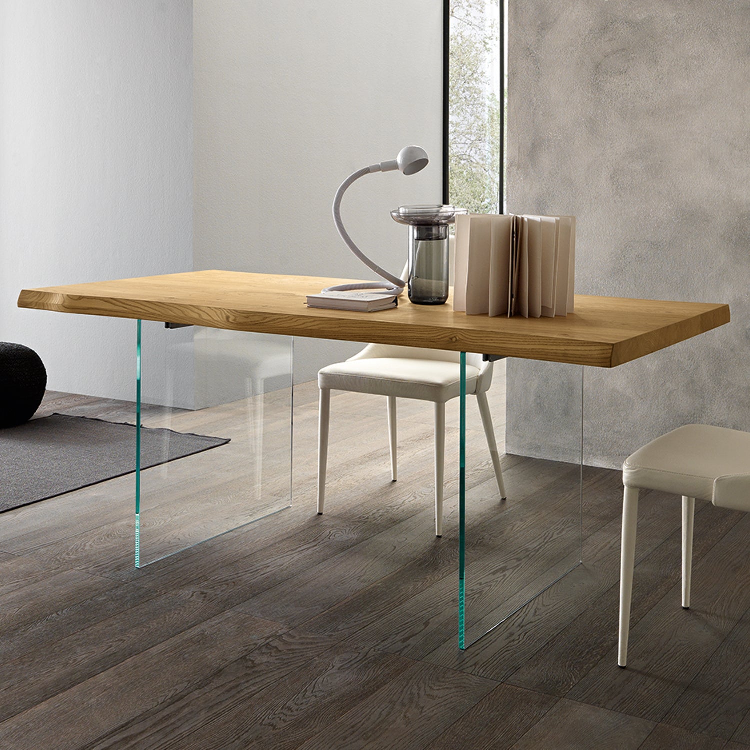 Meridiano extendable dining table by Altacom with transparent glass legs and wood top creating floating design effect