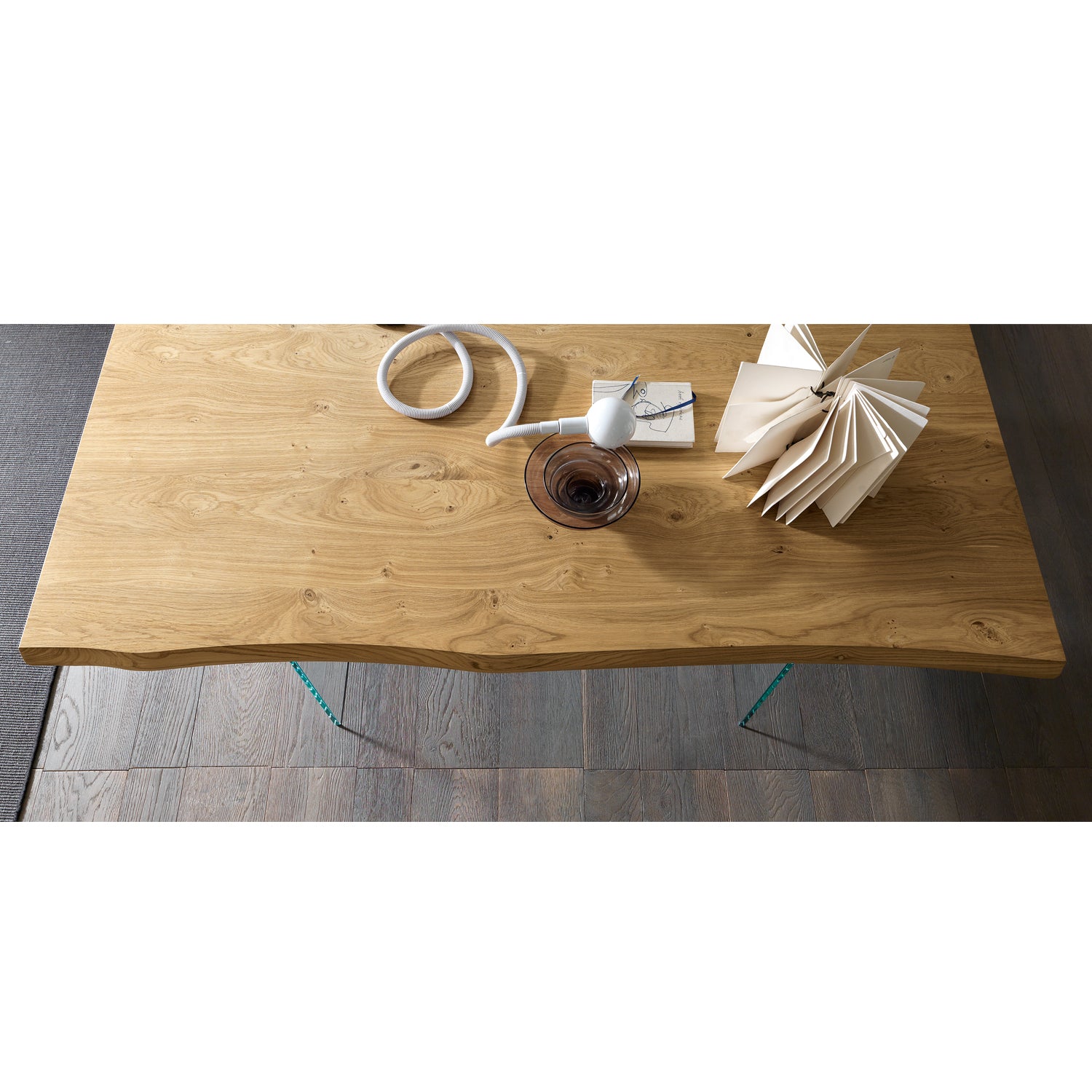 Meridiano dining table top detail showing natural wood finish and grain texture with glass legs structure