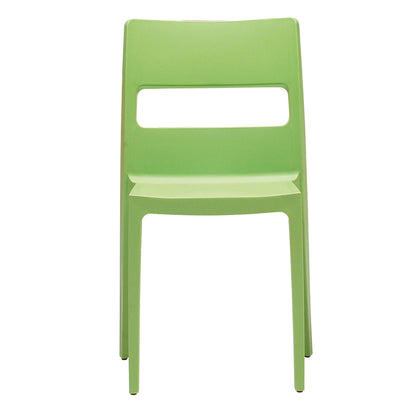SCAB Sai chair in pistachio green with a minimalist contemporary design, made from stackable glass fibre reinforced technopolymer for indoor and outdoor dining spaces, Made in Italy.