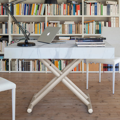 Ulisse convertible table by Altacom used as desk at dining height with laptop showing multi functional use